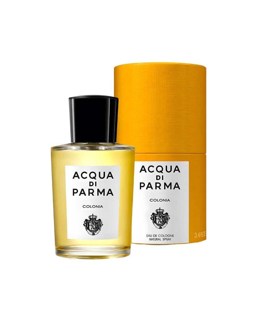 Frasco de Acqua di Parma Colonia Eau de Cologne 100 ml junto a su clásica caja cilíndrica amarilla.